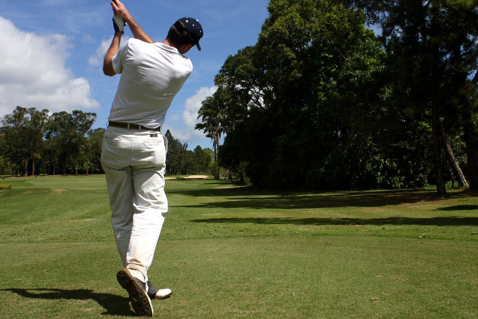 playing in a golf tournament